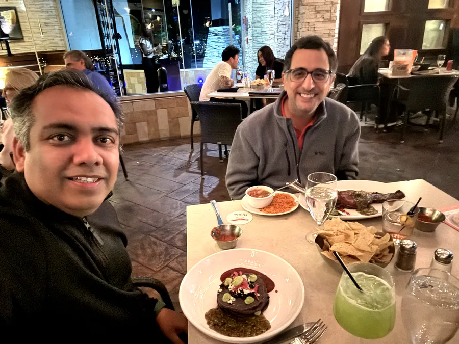 Jigar Desai and Raul Crespo sharing a meal and conversation
